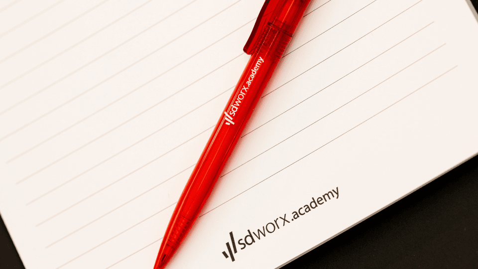 SD Worx Academy notebook and pen